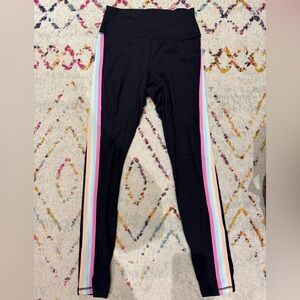 Size small black leggings with rainbow stripe down the sides